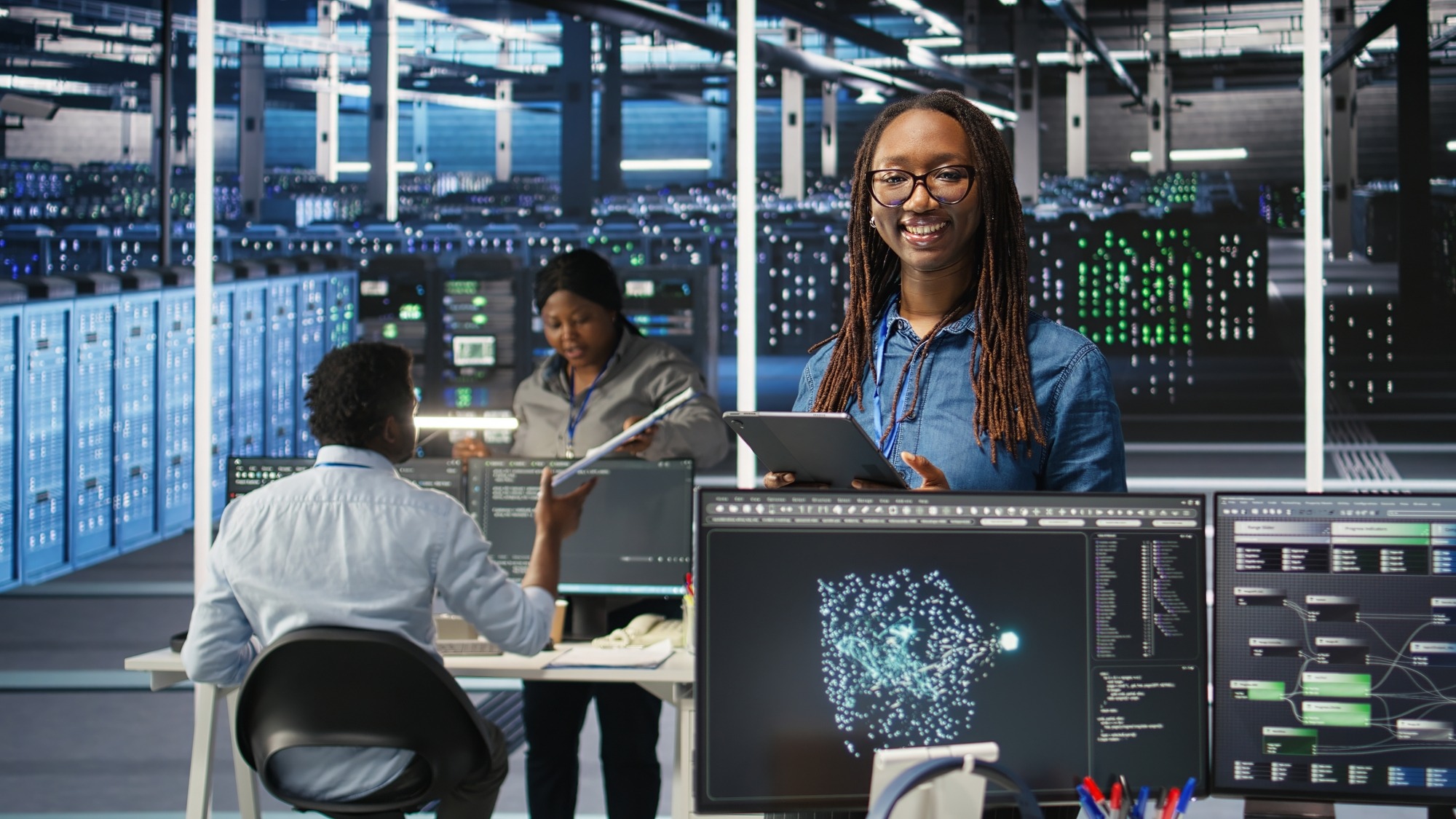 Portrait of upbeat server hub software developer using node tree software to optimize system health. Radiant data center staff member analyzing rigs issues using AI visualization, camera A.